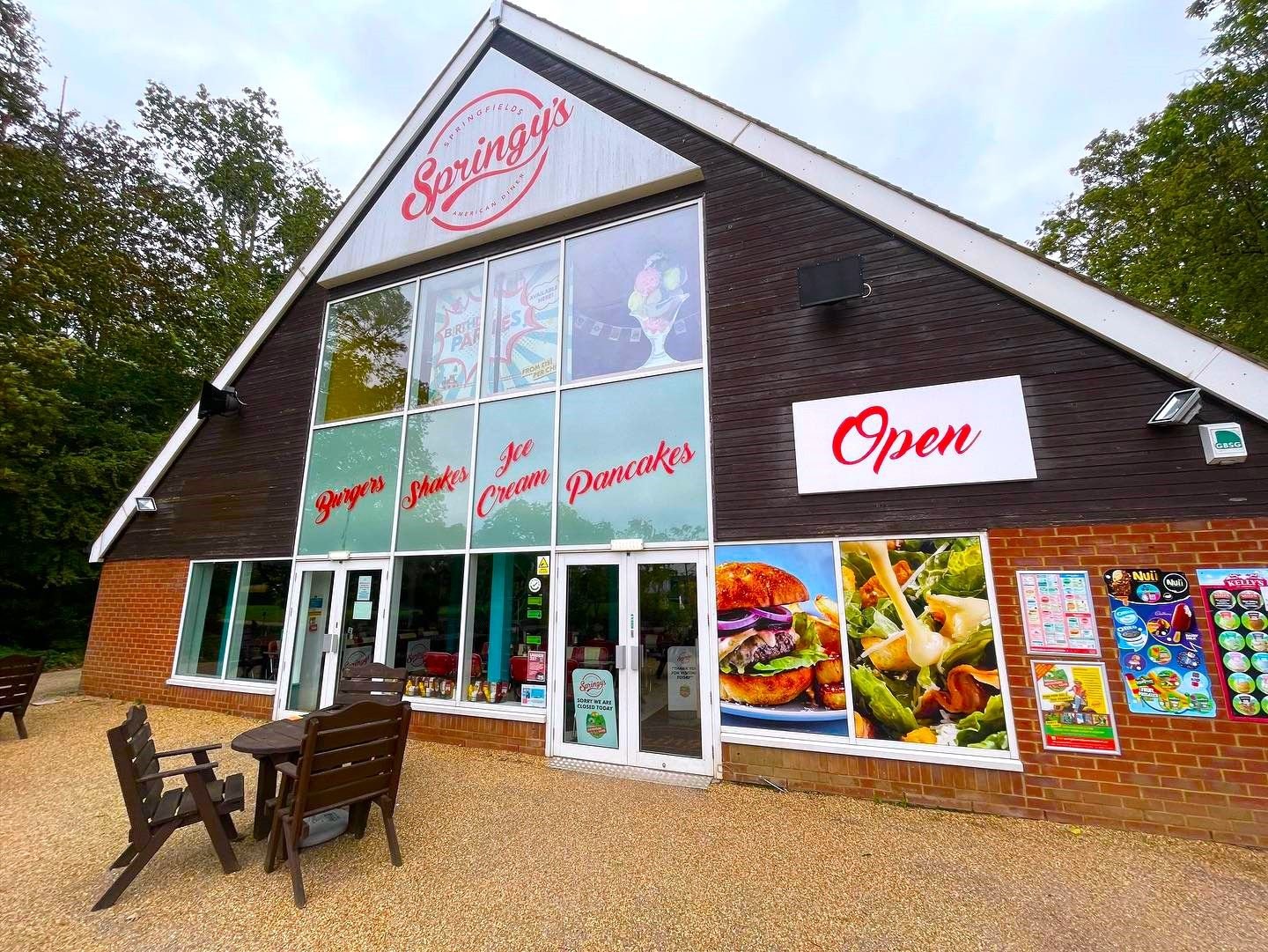 A café shopfront with a glazed gable and glass entrance doors