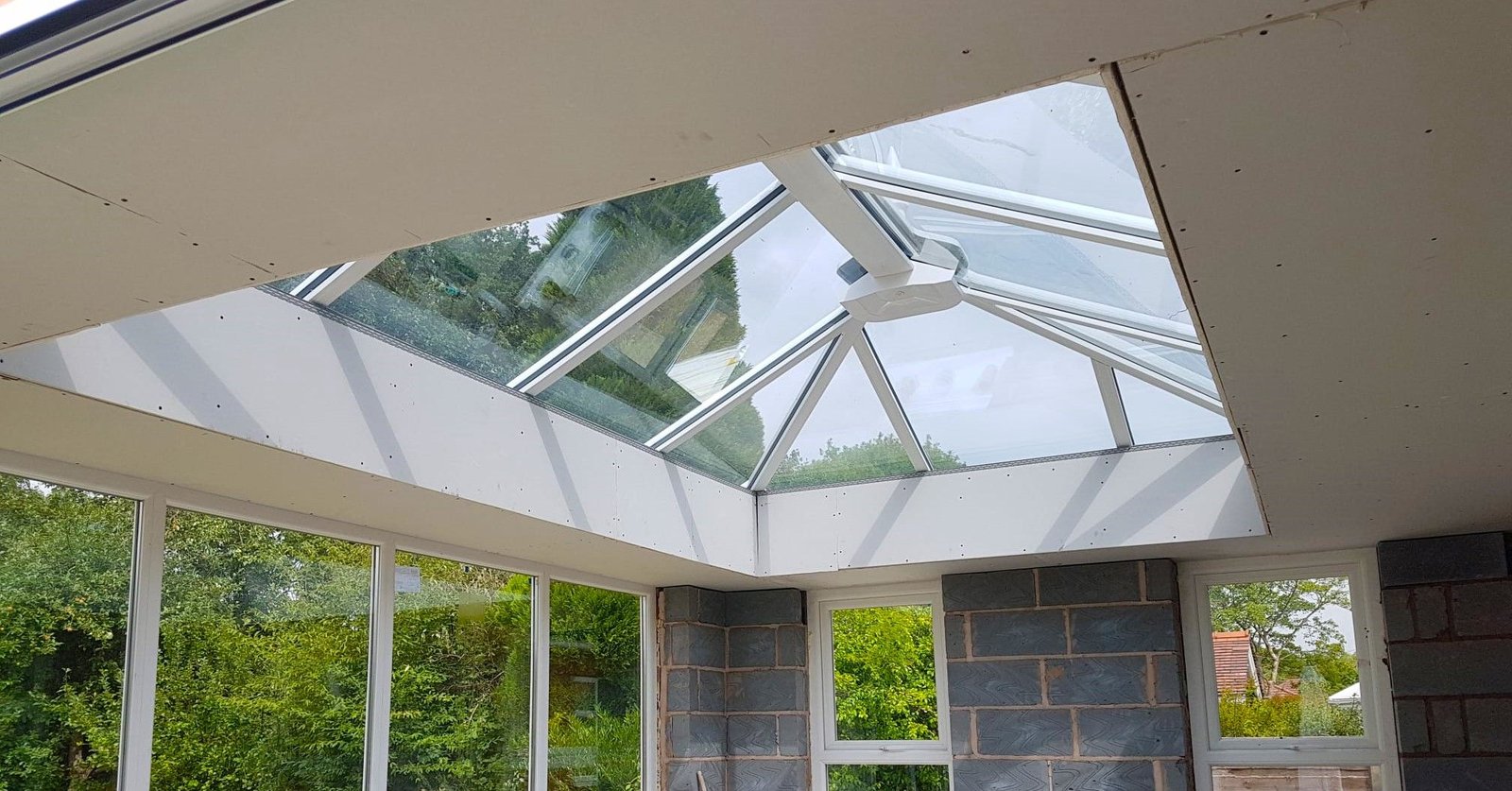 Looking up through a glass conservatory roof