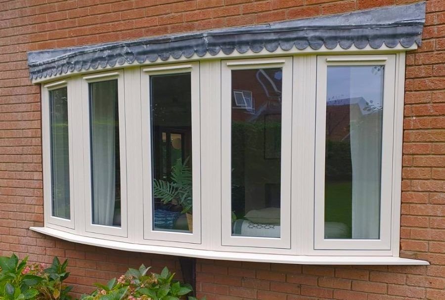 A cream bay window with a canopy above